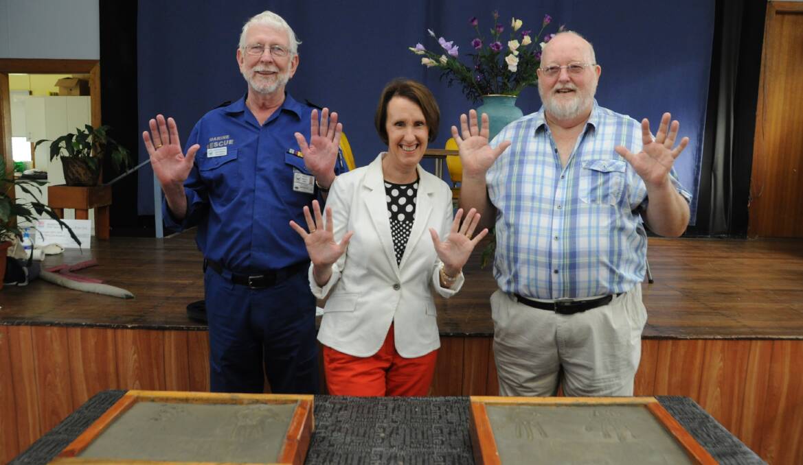 Harrington Crowdy Head Marine Rescue's John Fitzgerald, member for Port Macquarie Leslie Williams and Harrington Men's Shed's Bob Downing placed hand prints into the foundation stones.