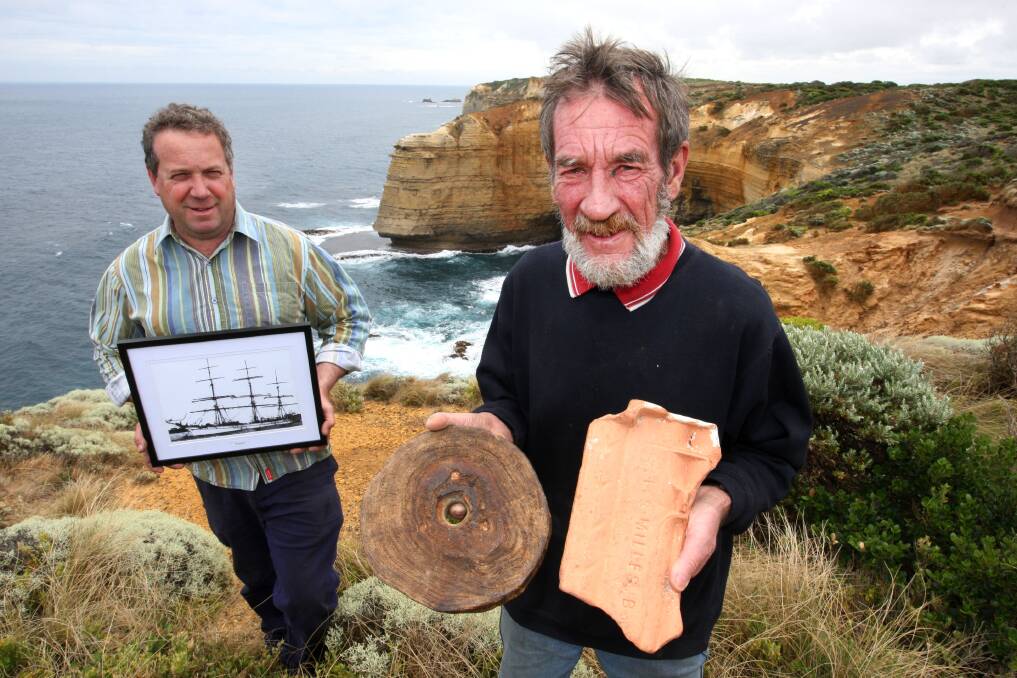 A century has passed since the tall ship Antares was wrecked off Peterborough and shipwreck centenary committee secretary Steve Cumming (left) and president Rex Mathieson, pictured with mementoes of the wreck, are preparing to mark the occasion. 141205LP50 Picture: LEANNE PICKETT