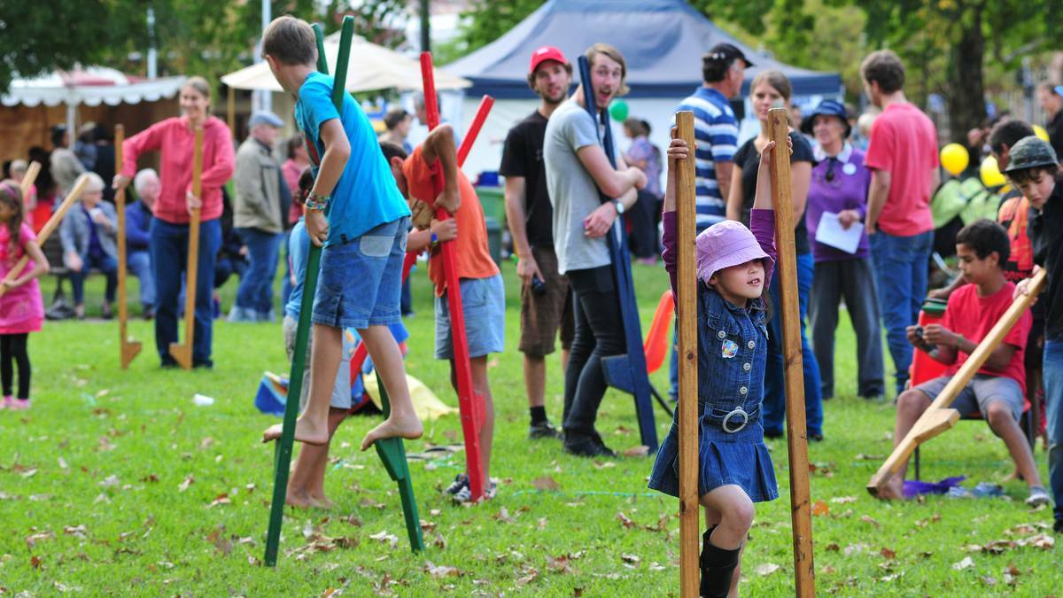 ORANGE: Michaela Chown with long legs at Robertson Park on Sunday as families gathered for the Easter Family Festival. Photo: Jude Keogh/Central Western Daily.