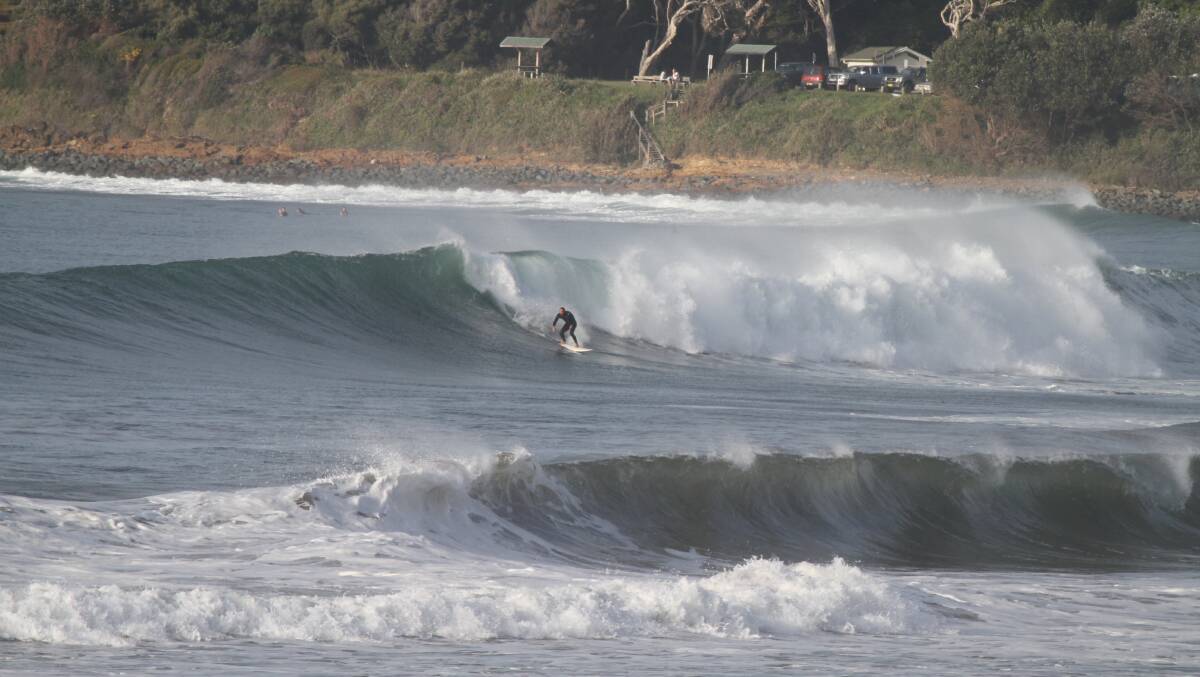 A surfer takes on the big swell at Salterwater Point on Tuesday. Photo: Carl Muxlow