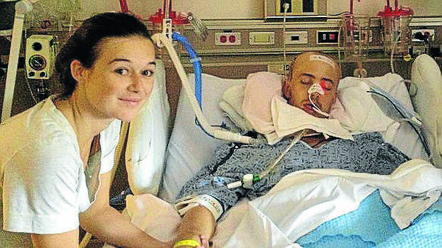 Robert Scott and girlfriend Amy Jarvis in the intensive care award in Fresno, California.  

