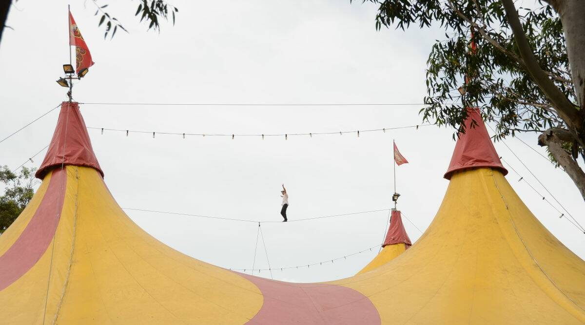 HOLD YOUR BREATH: Fourth generation circus performer Ash Brophy walks a tightrope high above the big top at Forster.  
