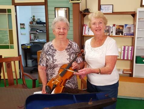 Violin part of Wingham's musical history: Musician June Jenkins and Manning Valley Historical Society president Barbara Waters.