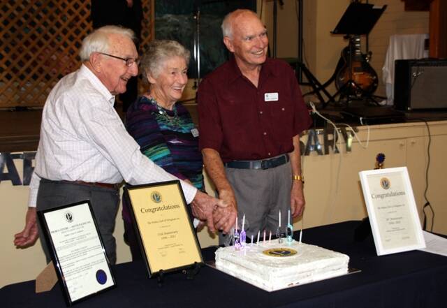 Cutting the birthday cake are Wingham Probus life members Doug Rae, Lorna Baillie-Mace and John Thornburn. Picture supplied.