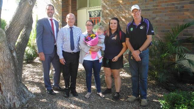 Presentation of proceeds: Wingham High School acting principal Paul Ivers and Chatham High School acting principal Merv Presland presented the proceeds of the sale of the steer to teacher Ed Manganaro's partner Lynette and her daughter Isobel. On Lynette's left are student Hayley Brood, who broke the steer in, and agriculture teacher Charlie Cassels. Picture: Julia Driscoll