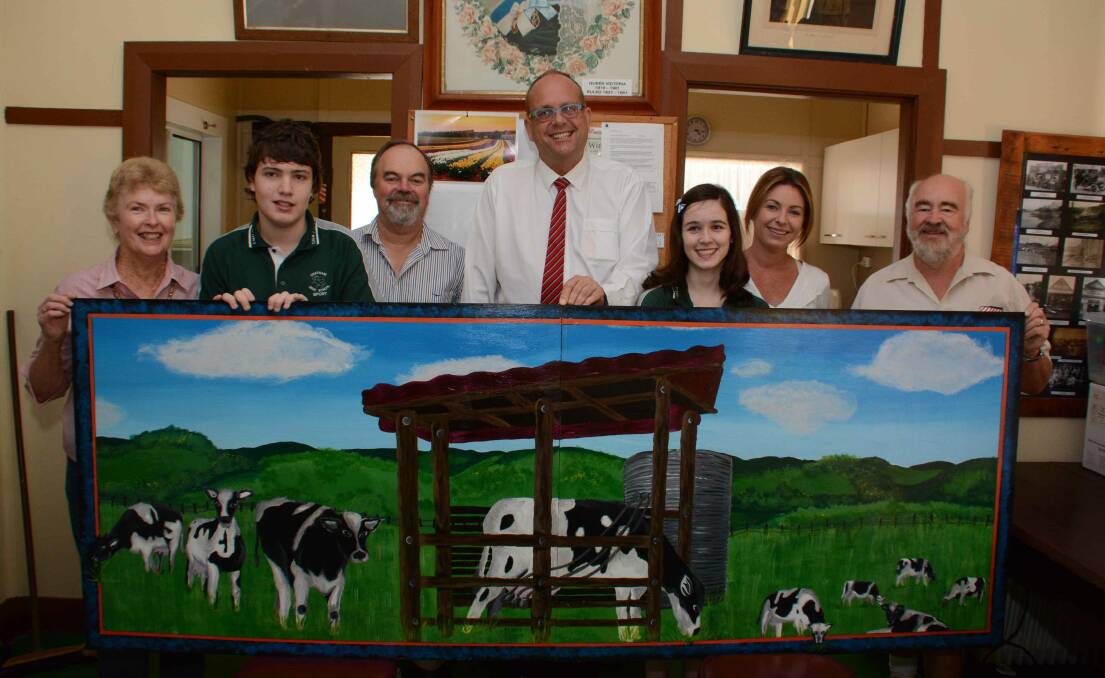 Mooing mural: President of MVHSM Barbara Waters, Jacob James, local farmer Tim Bale, principal of Chatham High School Willem Horvast, Emma Campbell, art teacher Michelle Pellew and Bob Berry.