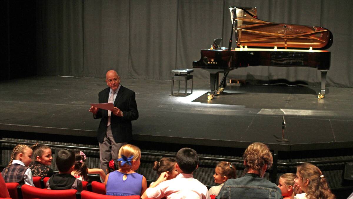 Adjudicator Richard Morphew delights and inspires young pianists with animated advice at the Taree and District Eisteddfod at Manning Entertainment Centre.