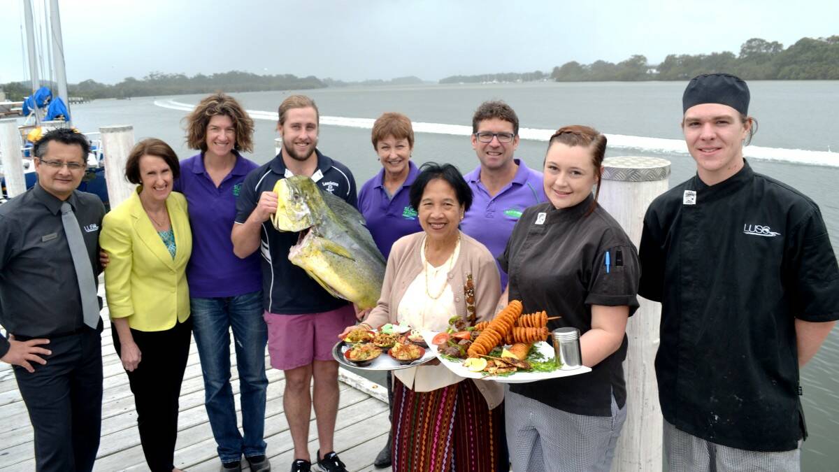 TIME TO LIVE IT UP: Ready to serve at Slice of Haven are organisers, a supporter and vendors, from left, Gordon Wiegold, Member for Port Macquarie Leslie Williams, Julie Krige, Cody Weston from Laurieton Seafoods, Kerry McFadyen, Tin Hta Nu from the Mid North Coast Refugee Support Group, Robert Dwyer and LUSC chefs ​Yasmine Egan​ and Isaac Nagy.