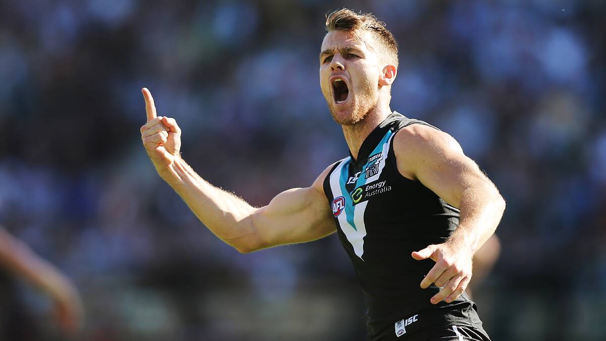 Robbie Gray of the Power celebrates after kicking a goal . Photos: Getty