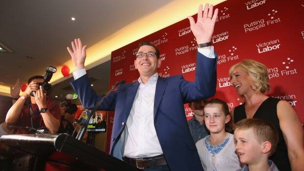 Labor Party leader Daniel Andrews, with his wife Catherine Andrews and family, celebrates the election victory. Photo: Scott Barbour