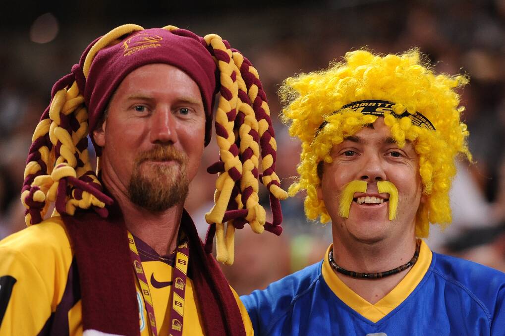 Broncos and Eels fans show their colours at Suncorp Stadium. The Eels defeated the Broncos 25-18 on Brisbane turf in Round Five of the NRL. Picture: Getty Images