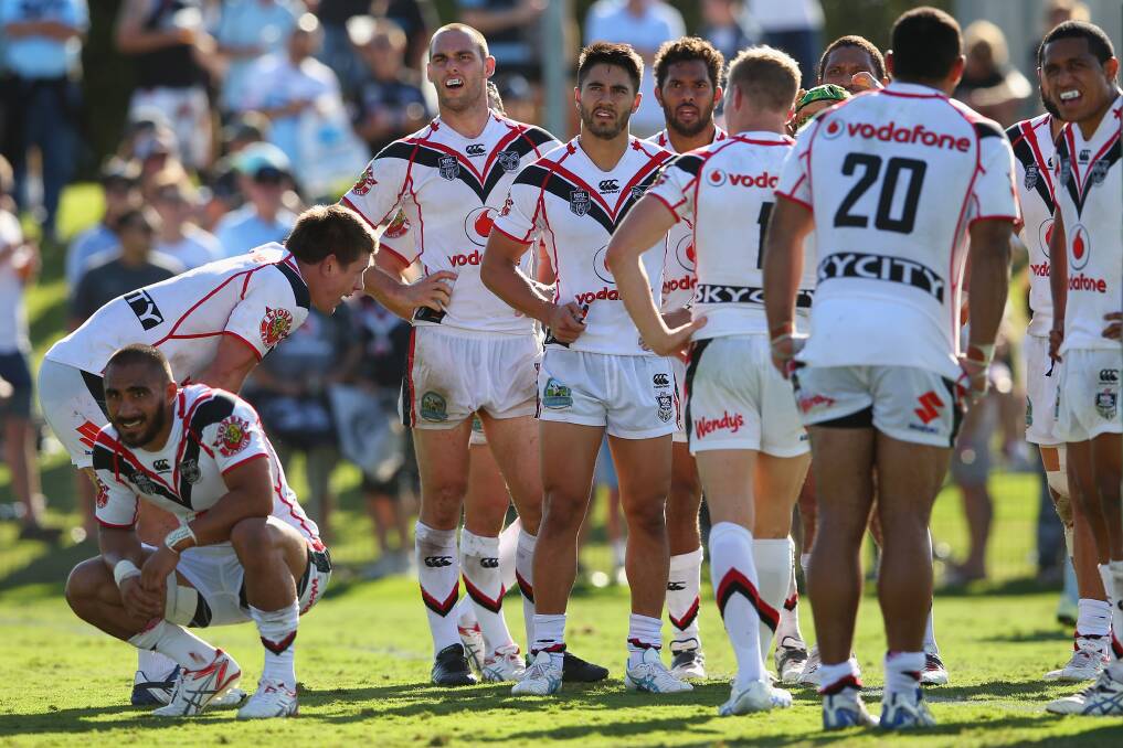 The Warriors players look dejected after a Sharks try. The Sharks trounced the Warriors 37-6 to record their first win for the season. Picture: Getty Images