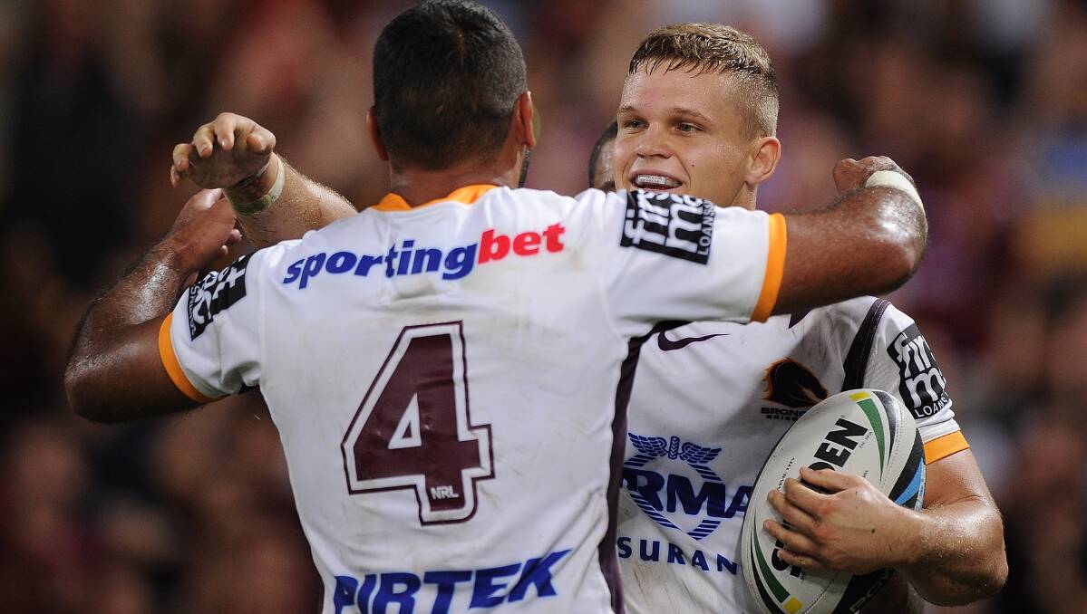 Dale Copley of the Broncos celebrates scoring a try with Justin Hodges. The Eels defeated the Broncos 25-18 on Brisbane turf in Round Five of the NRL. Picture: Getty Images