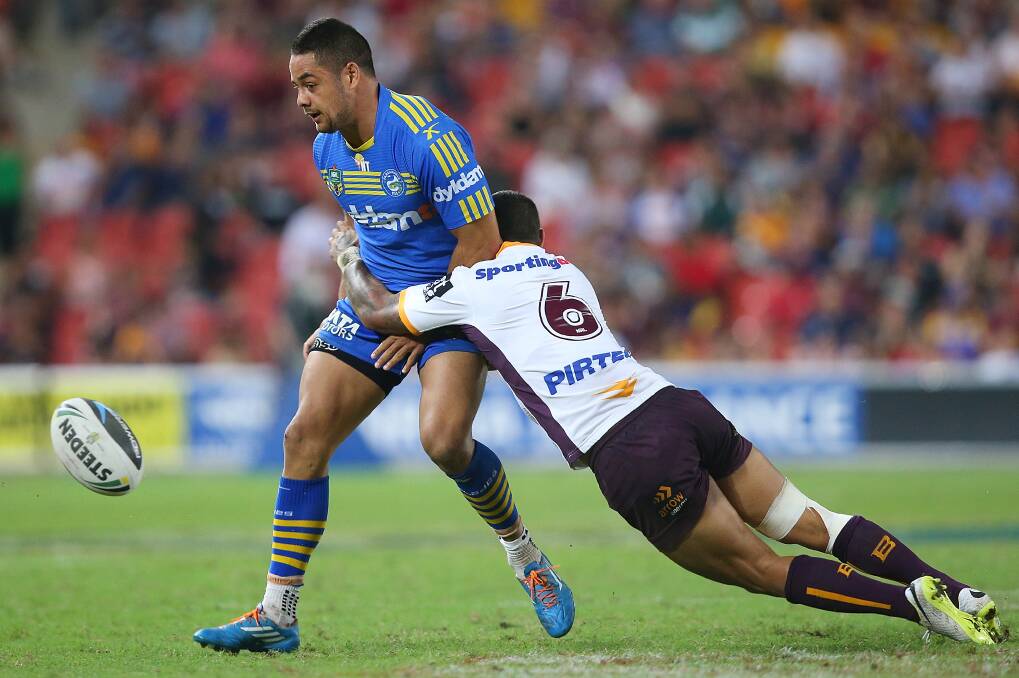 Jarryd Hayne gets the ball away just before being tackled. The Eels defeated the Broncos 25-18 on Brisbane turf in Round Five of the NRL. Picture: Getty Images