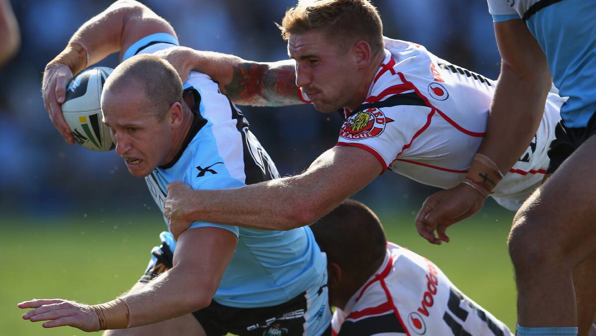 Jeff Robson of the Sharks is tackled. The Sharks trounced the Warriors 37-6 to record their first win for the season. Picture: Getty Images