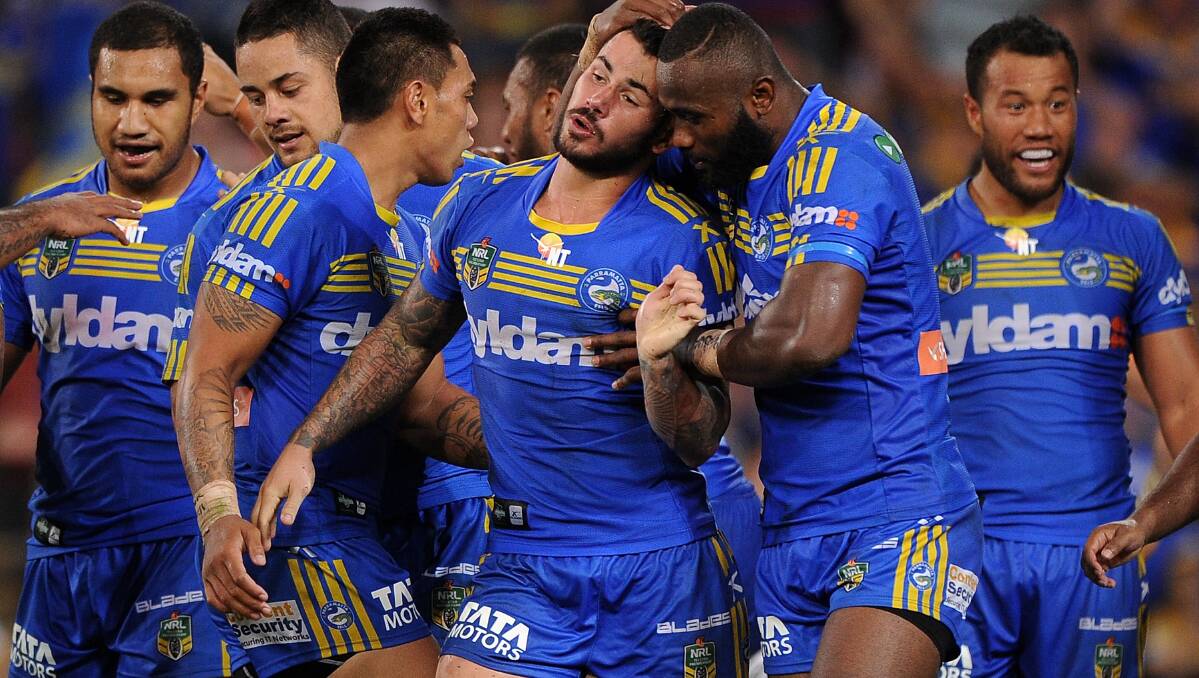 Nathan Peats celebrates his try with Parramatta teammates. The Eels defeated the Broncos 25-18 on Brisbane turf in Round Five of the NRL. Picture: Getty Images