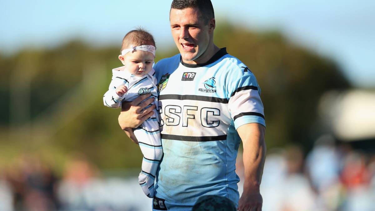 Michael Gordon of the Sharks leaves the field with his children after the round five NRL match between the Cronulla-Sutherland Sharks and New Zealand Warriors . The Sharks trounced the Warriors 37-6 to record their first win for the season. Picture: Getty Images