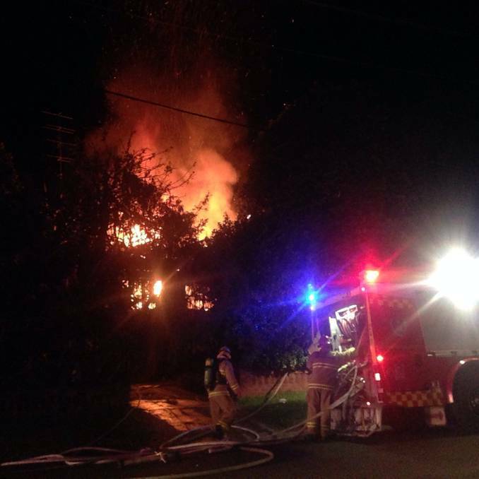 The house at 2 Cresting Avenue, Corrimal, engulfed in flames. Picture: Supplied to the Illawarra Mercury