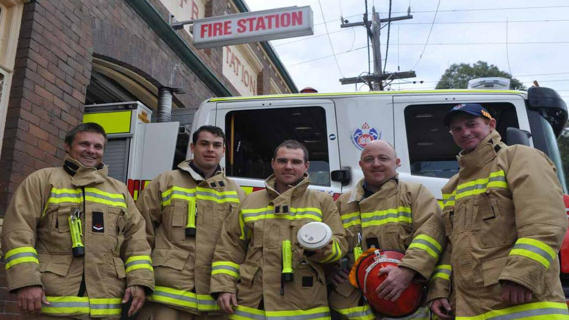 Cessnock firefighters Ben Hunter, Cameron Clarke, Shaun Knuth, station officer Craig Prentice and Marc Bender, are urging seniors in the community to change their smoke alarm batteries. Picture: Cessnock Advertiser