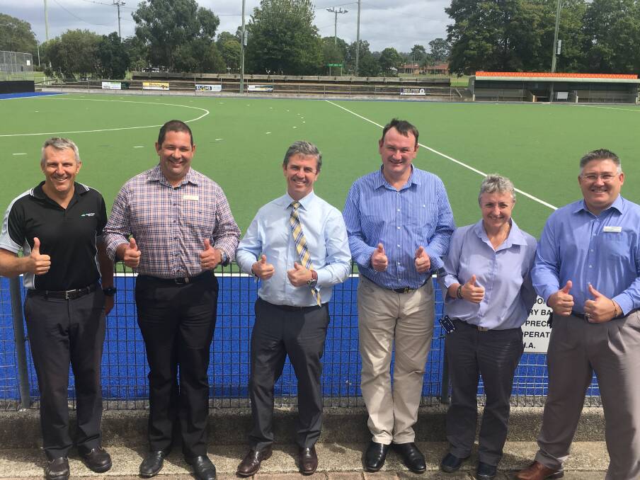 Approved: Councillors Michael Cross and Dan Aldridge, Federal MP Dr David Gillespie, Craig Colvin, Manning Hockey President Debbie Monck and MidCoast Council's Paul De Szell are giving a new upgrade to the Taree Recreation Grounds a thumbs up. Photo: Robert Nardella 