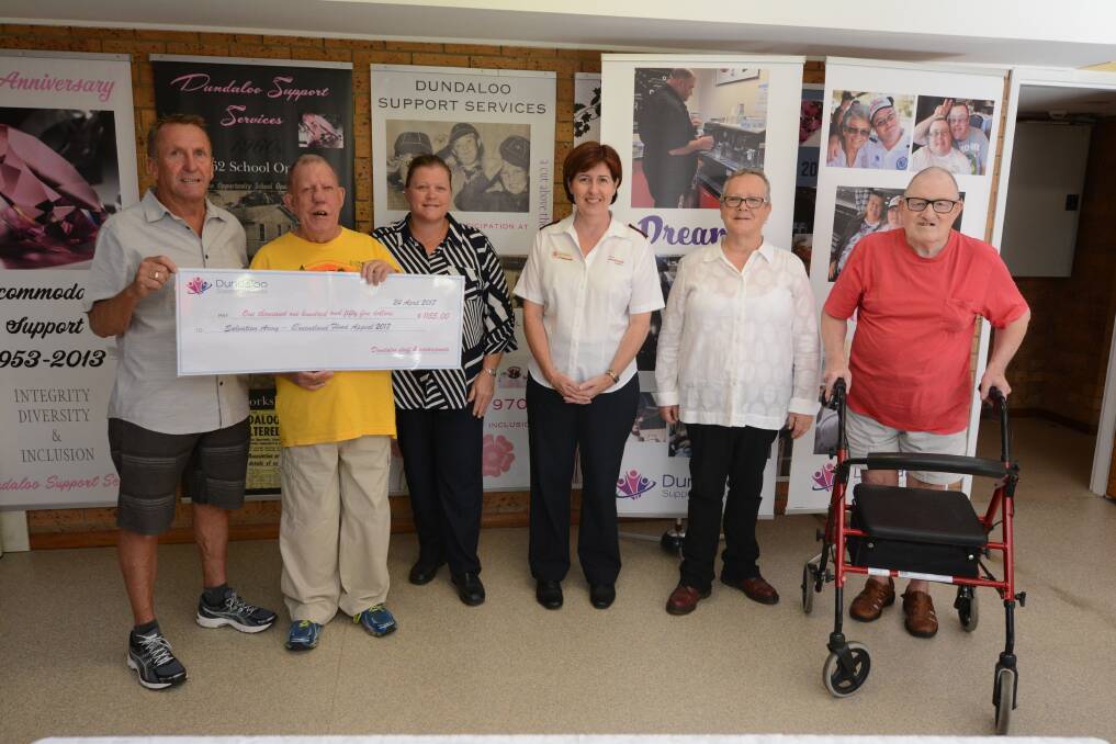 Supporting the cause: Mick Young, Steve Curtin, Allison Ryan, Louise Beamish, Shelly Sabey and Henry Esbank were on hand for the cheque presentation.