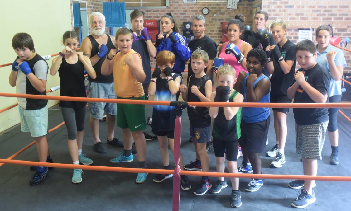 Henry assists with training the next generation of boxers at the Taree PCYC.