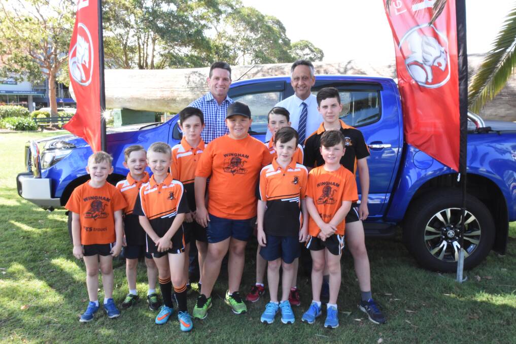 Special guest: Former NRL player Danny Buderus was welcomed by the Wingham Tigers and Holden representatives for the cheque presentation. Photo: Scott Calvin. 