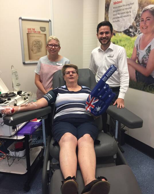 Feeling patriotic: Donor Nola Bath, nurse Ange Callaghan and community relations officer Felix Palmer are urging people to donate blood before Australia Day.