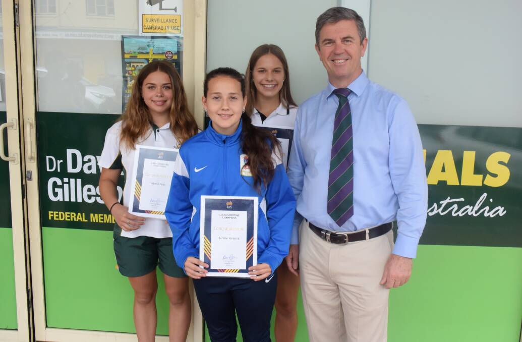 Assistance: Xanthe Parsons, Isabella Deas and Bree Pensini accepted their grants from Member for Lyne Dr David Gillespie. Photo: Rob Douglas. 
