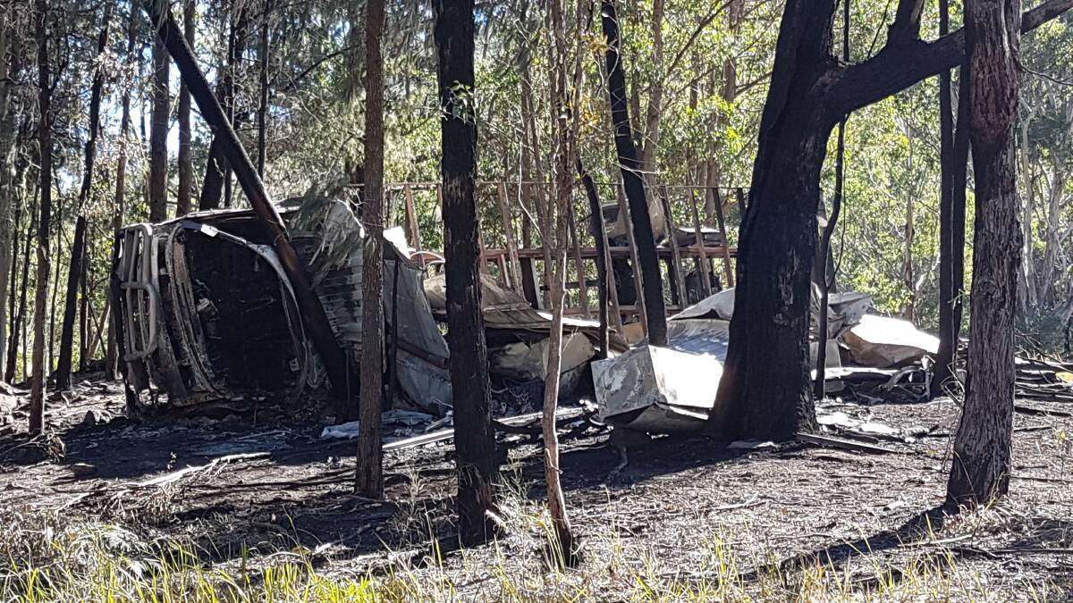 Police are working identify the occupants of a truck that crashed into trees and caught fire at Giro. Photo: Dave Armstrong.