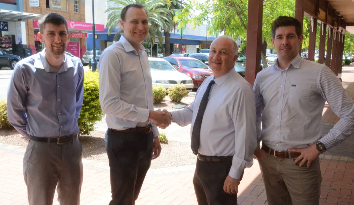 Changing of the guard: Kyle Brown and Adam Johnson accepted their new roles from Alan Tickle and Alex Cosway. 