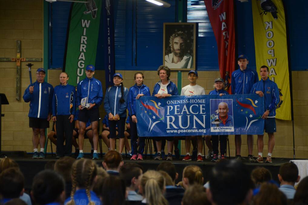 A message of peace: Members of the Sri Chinmoy Oneness-Home Peace Run sang to the students during their visit. Photo: Scott Calvin. 
