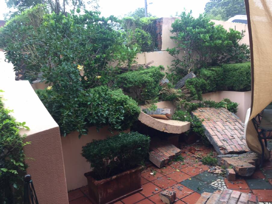 Destroyed: The front courtyard of a Taree woman's house has been severely damaged after a car drove into it on Thursday.