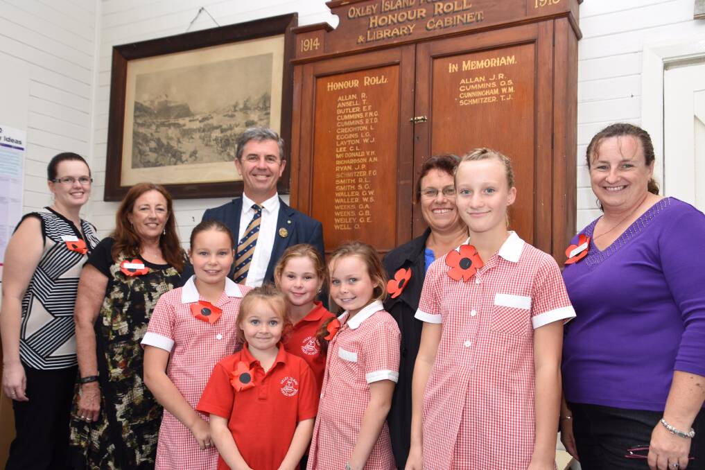 Remembering the sacrifice: Lyne MP Dr David Gillespie with teachers and students at Oxley Island Public School. The school is set to receive $2,509 from the Federal government to restore a World War I honour roll. 