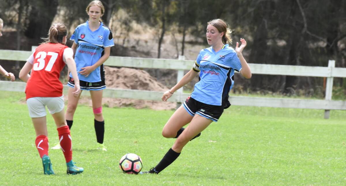Jenna Doyle sends the ball up field during FMNC under 17s clash with Merewether United in round one.