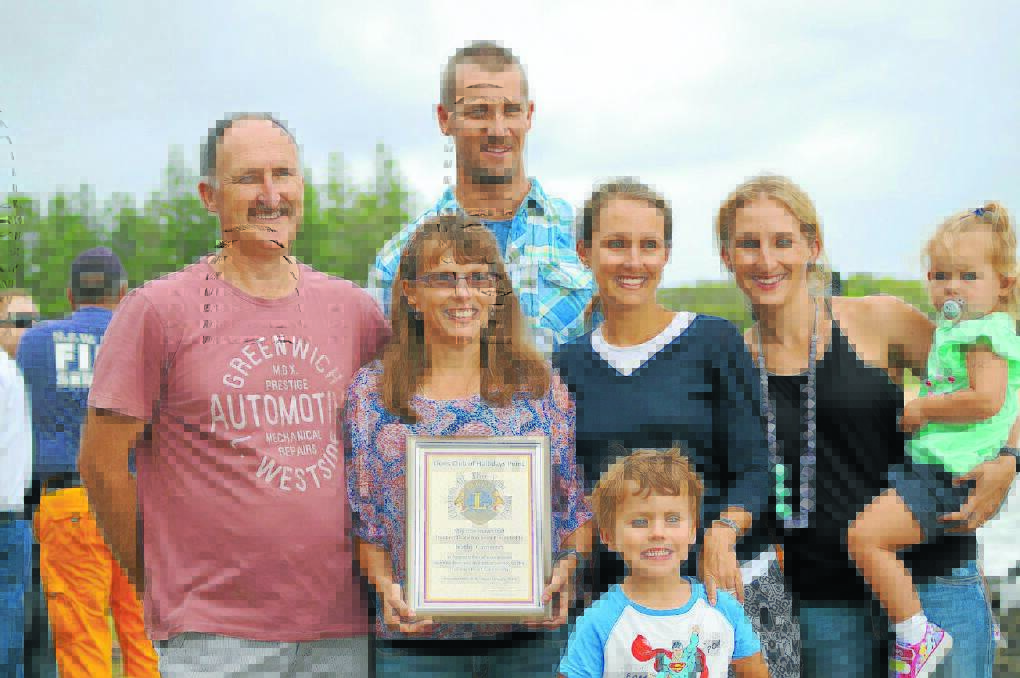 Hallidays Point citizen of the year, Kathryn Cameron, is congratulated by her family, husband Colin, daughters Megan and Kelly, grandchildren Oskar and Eliza and son-in-law Adam McCoy.