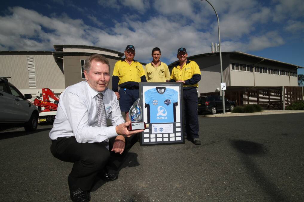 How sweet it is – a double victory: MidCoast Water general manager Robert Loadsman with members of the team at Bootawa treatment works, Geoff Kerr, Craig Stone and Jason Zabell. The winning water sample was taken from Jason’s home at Forster. The team won the jersey for the NSW competition and the trophy for the State of Origin title.