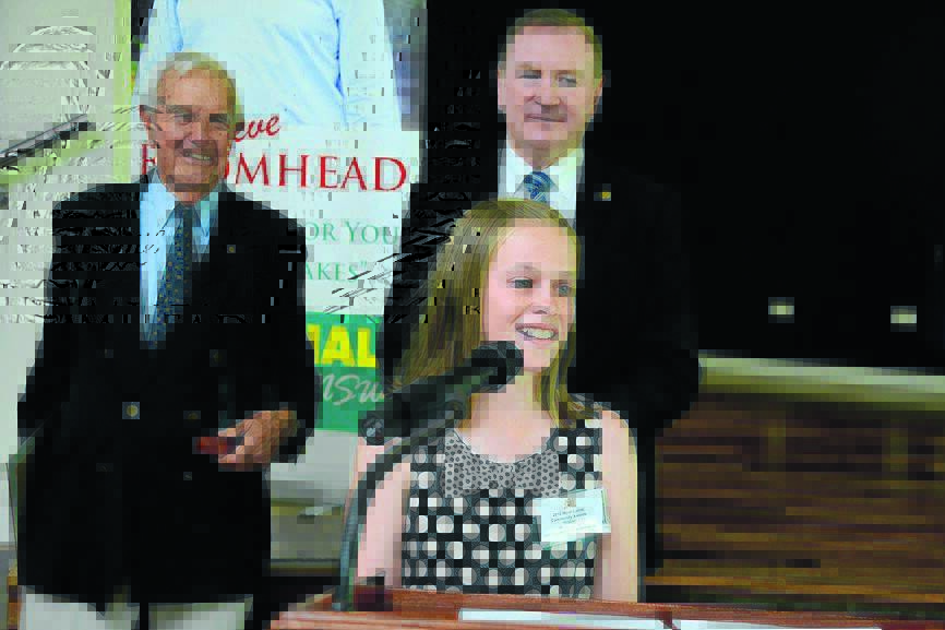 2013 Myall Lakes Junior Sports Person of the Year, Molly Arens from Old Bar, accepts her award. Also pictured are Ian Sinclair AC and member for Myall Lakes Stephen Bromhead.