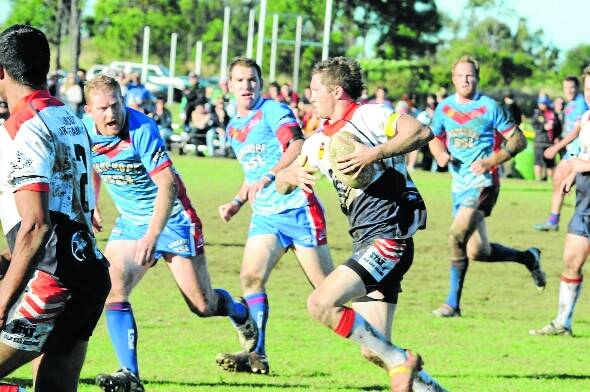 Old Bar fullback Daniel Morris makes a dash in the Group Three Rugby League game against Wauchope at Old Bar.