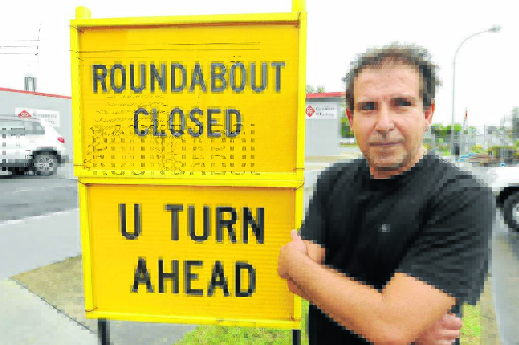 Labbi Kladis from Charcoal Chicken is among Pulteney Street business people feeling the pinch from continuing roadworks at the roundabout.