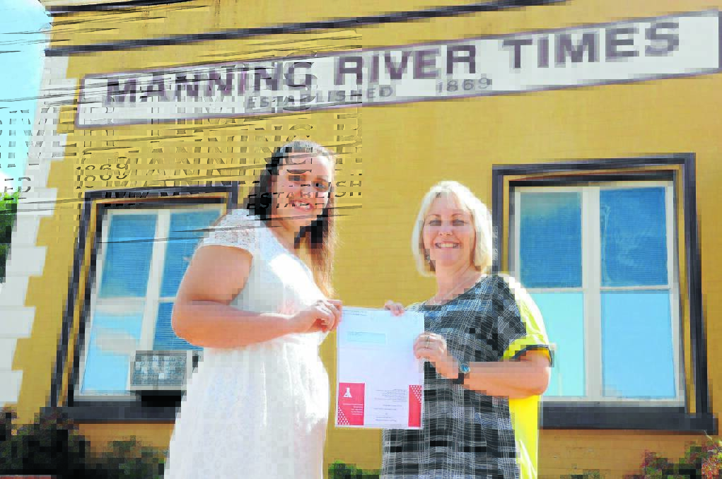 Times advertising consultant Leisa Smith presents Kayla Daczko with her prize.