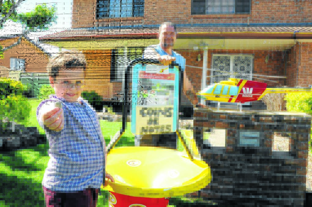 Bailey and Rodney Cribbin hope the Christmas light display at their family home in Bushland Drive will raise funds for the Westpac Rescue Helicopter service.
