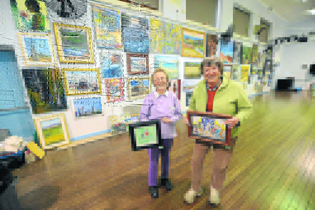 Beryl Moriarty and Helen Maybury with a selection of some of the works on show.