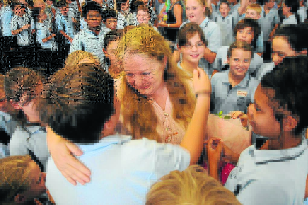 Gail Young is congratulated by St Joseph's Primary students.