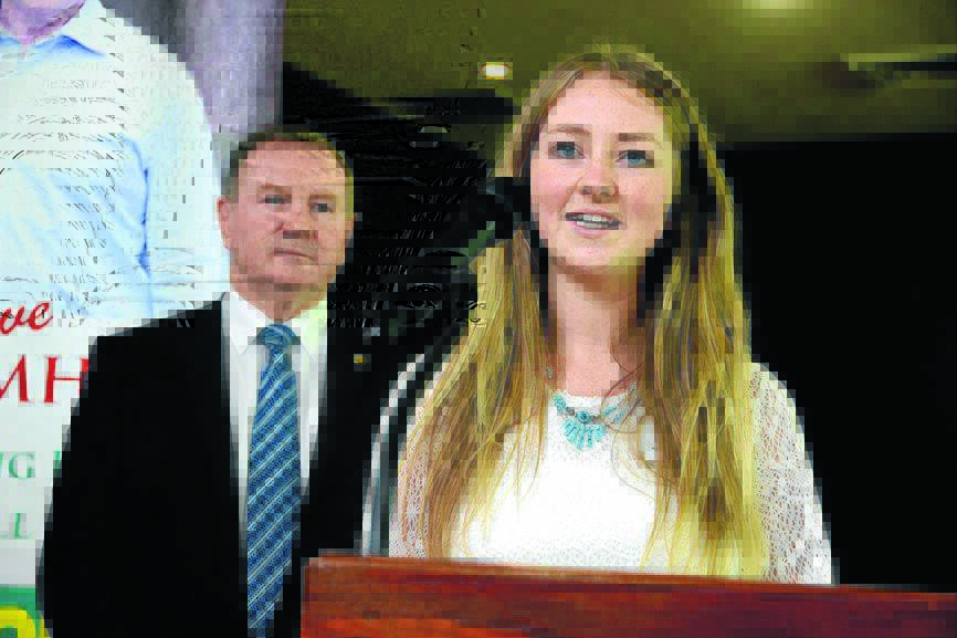 Myall Lakes Young Person of the Year, Amani Jensen-Bentley accepts her award, watched by Stephen Bromhead.