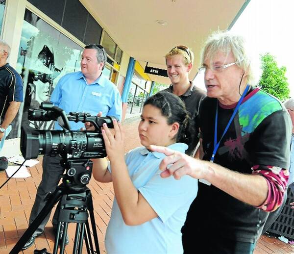 Action: Taree Public student Zoe Otm gets some sound advice from filmmaker Greg Smith under the watchful eye of principal Peter Johnson and teacher Joshua Mawby.