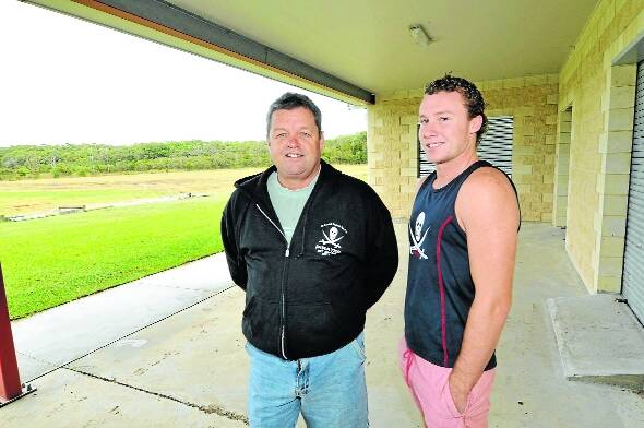 Old Bar Rugby League Club senior vice president Craig Wheeler and his son, Corey, an Old Bar player, look over facilities at the Ocean Blue fields. The Pirates could  play home games at the complex for the remainder of the Group Three season.  Old Bar’s next home game is scheduled for Saturday May 5.