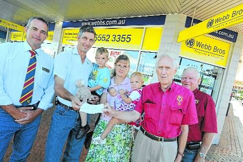 From left, Webb Bros' Dave Callaughan, Stephen Stace holding son William, Emily Stace with daugher Sarah and Joe Neufeld and Tom Ellis from Taree Lions Club.