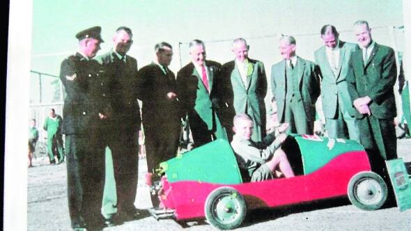 Pictured on the day the track was opened. From right, Rev Bill Hardie, Taree Rotary president Cliff Douglass, mayor Eric Martin, Rev Phil Lucock MP and three others unknown. The driver is unknown. If anyone can help identify these people, can they please call Max Carey on 6553 9304.