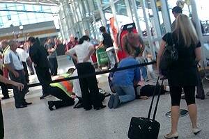 Paramedics battle in vain to save the dying man - bashed during a bikie brawl at Sydney Airport.